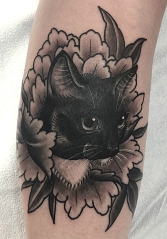 Traditional black and grey cat portrait tattoo, or cattoo, in peony flower, made in Toronto