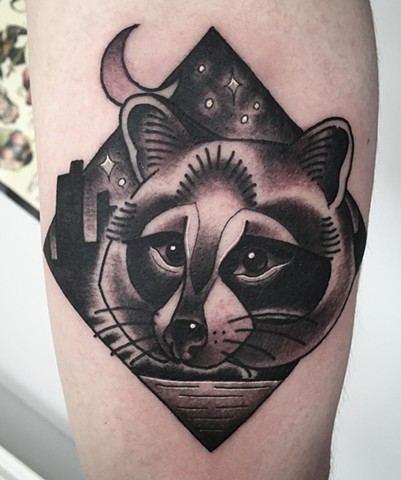 Black and grey traditional raccoon, or trash panda tattoo in a folksy style, depicting Toronto