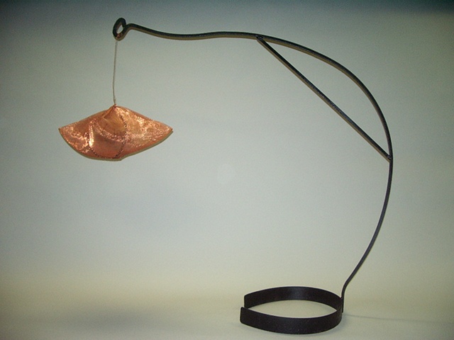 felted eggs in a copper mesh nest suspended by an iron armature