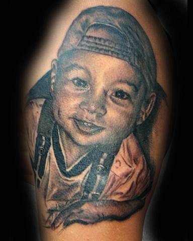 Child's Portrait Black & White by Tiffany Garcia Tattoo Artist Original Custom Tattoos located in Long Beach, Huntington Beach, Carson, Palos Verdes, Los Angeles, West Hollywood, Pacific Coast Highway and surrounding areas in Southern California.