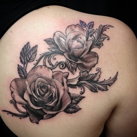 Black and grey roses by Female tattoo artist Tiffany Garcia