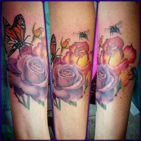 Colorful roses and bumble bees by female tattoo Artist Tiffany Garcia