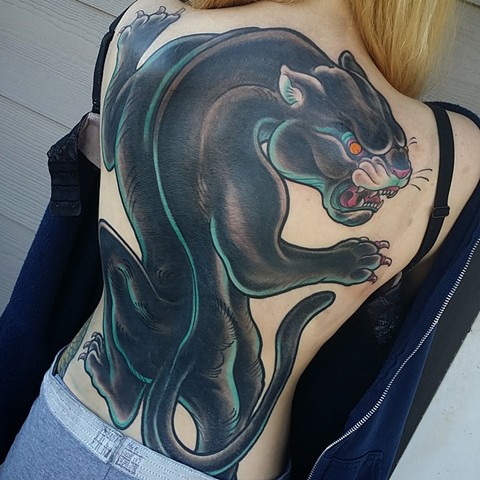 Traditional panther backpiece tattoo