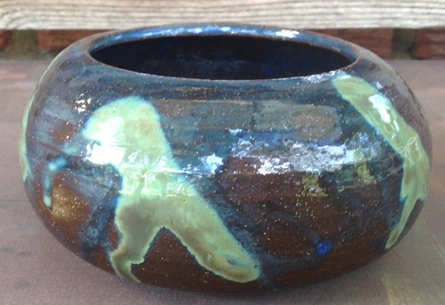 Dark brown bowl with 5 lambda markings in green