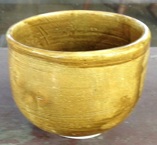 Tall, gold tea bowl