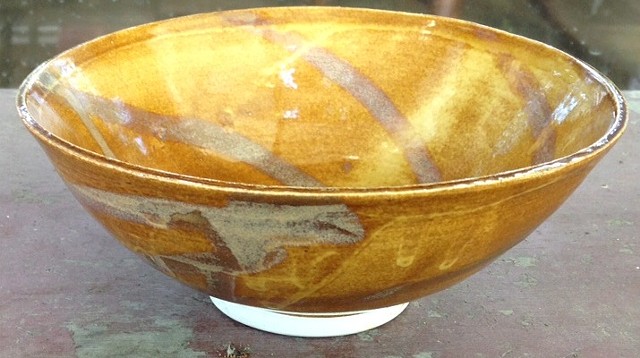 Gold bowl with spiral pattern