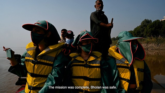 With Nazir Mirani (centre) who rescues dolphins stuck in canals