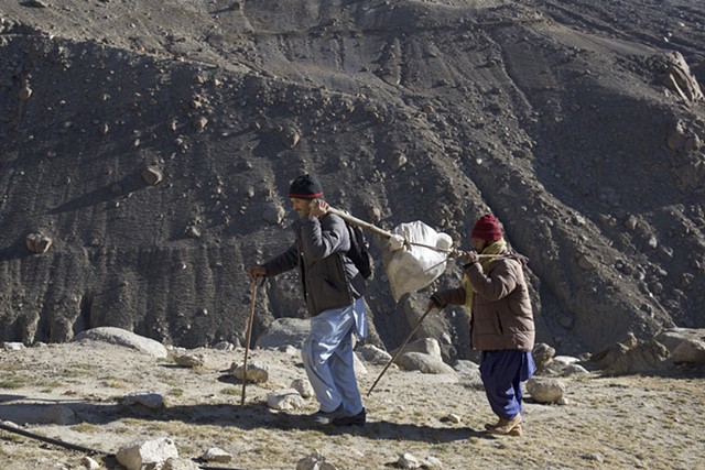 Carrying a chunk of a glacier up to the site for glacier-grafting