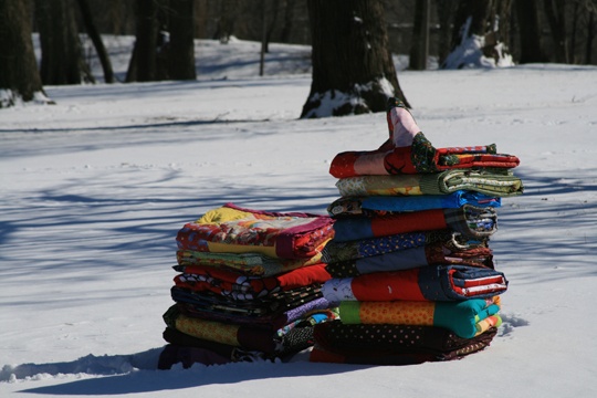 Quilts on a park bench