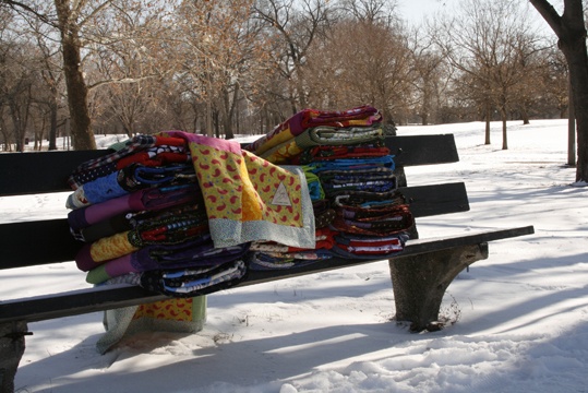 Quilts on a park bench