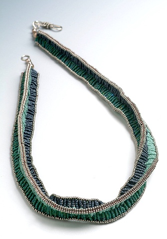 Three legged zulu stitch necklace