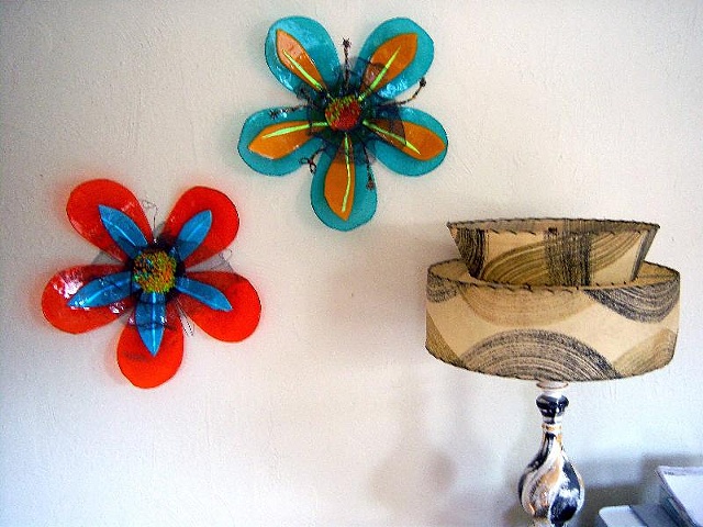 "Super-sized Flower Power" sculpture
Wire mesh is in the middle, along with beaded wires and stands out from the flower about 5.5".   The total diameter is about 17.5".  There is a built-in hanging wire loop so it's easy to hang.
Each one is $385 or you c