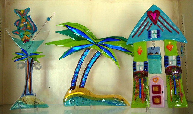 Key West Vacation
Details:
'Key West Martini' that measures about 18 inches high by 9 inches wide and costs $250. 
"Keys Tree," measuring about 13.5 inches high by 10 inches wide and costs 
$300. The "Keys Tree" hangs by wire loops under fronds.
Love Hous