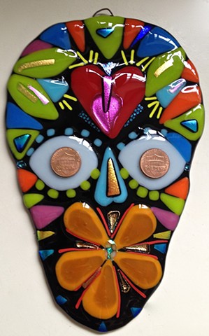 "Sugar Skulls"...in black with red heart...and orange flower...




