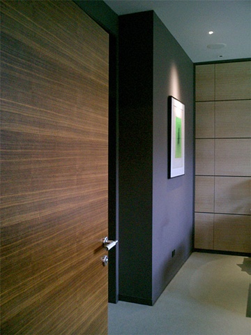 Washington Square Loft, Poliform walnut door, modern modern minimalist  bedroom, by Doug Stiles Interior Design