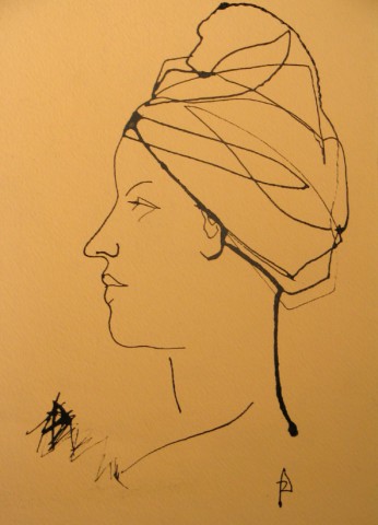 head of a woman with towel wrapped around her head