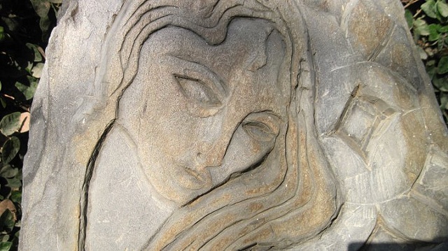 Inset of a Woman's Tombstone