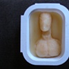 portrait of the artist as spider-man cast in beeswax placed in a packet of Mc'donalds Honey moments before being sealed in original wrapper 