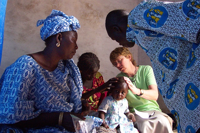 Missionary nurse examining child - Mbaakhe
