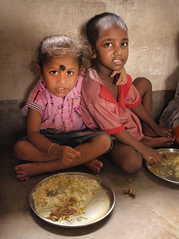 Children at Calcutta Mercy school eating lunch