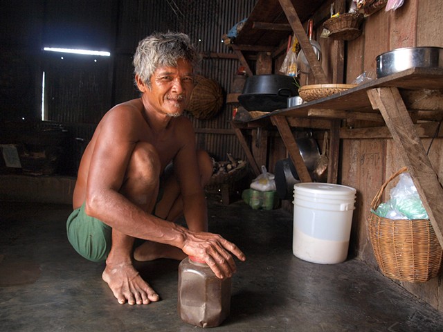 Villager in his home getting coffee