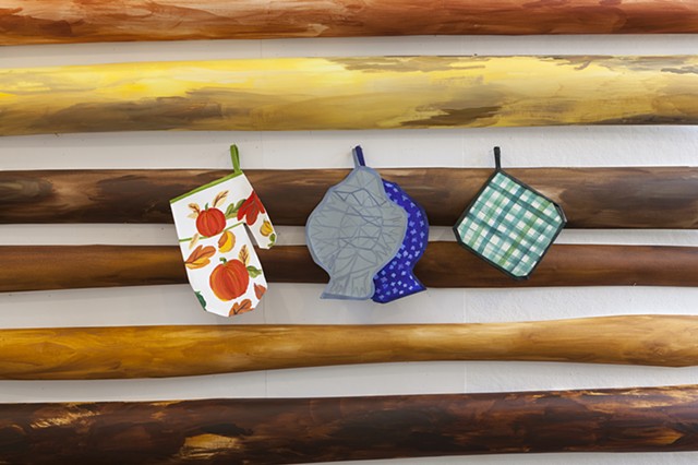 Log walls, oven mitts (detail)