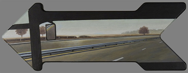 View of the road in a bus, painted on an arrow shaped panel.