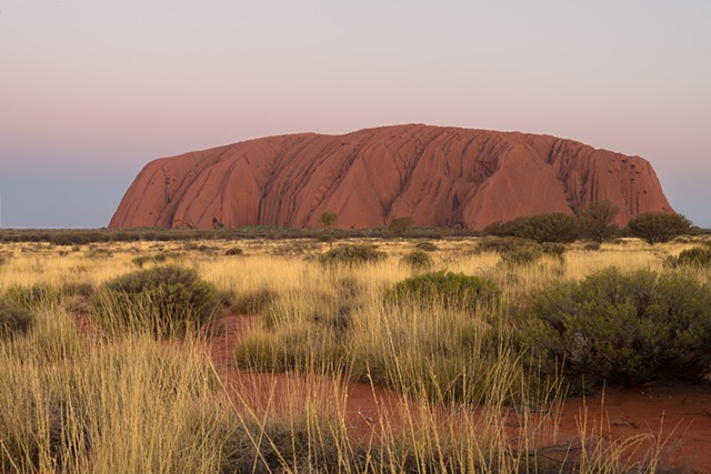Uluru at Sunset Goes Through a Range of Colours as the Sun Sets