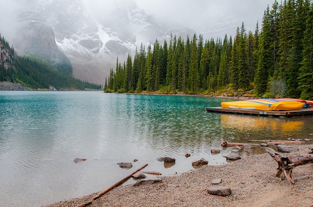 Moraine Lake with canoes in the distance, Banff National Park popular site.