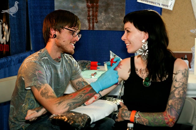 Stina getting tattooed