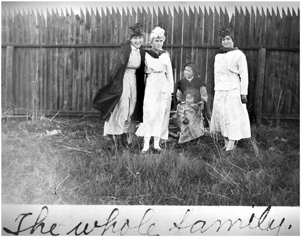 "The Whole Family" (Nina second from left). I wondered about the social status of the seated mother and child. A few years later the Ellendale Museum received an album of photographs taken by one of Nina's friends in this picture. The inscription on the b