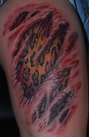 leopard skin rip tattoo by dave zobe lat 212 tattoo richmond virginia