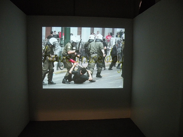 Installation of riot photos.  Have a Nice Day by Courtney Kessel