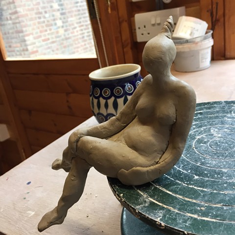On The Edge figurine with a Polish cup of coffe
