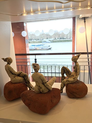 Thames Beach Ladies, in the window of Skylark 2 gallery, looking at the Thames river
