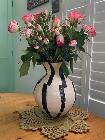 In Situ- vasr with black and white stripes