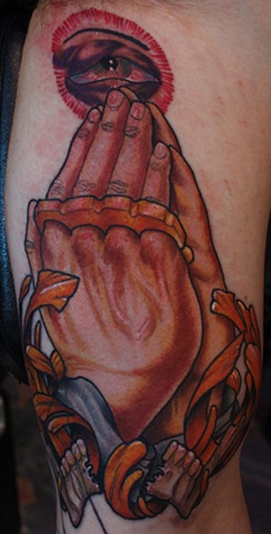 Praying hands with brass knuckles Eric James