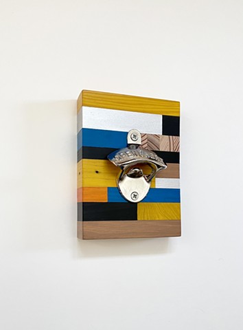 Wall mounted bottle opener with handmade salvaged wood backing. Contemporary craft by Andrew Traub