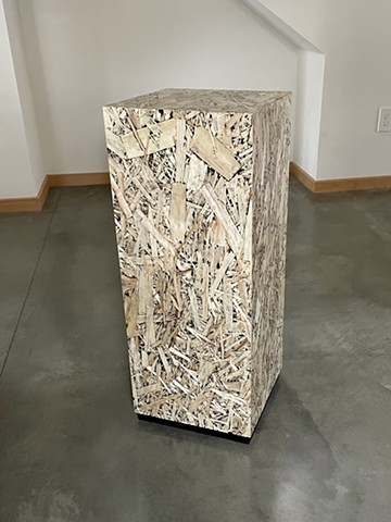 OSB Pedestal, modern wafter plywood furniture with a black inlay finish.