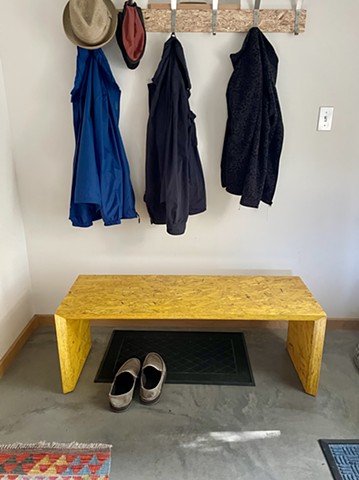 Modern OSB Arch Bench with a yellow waterbased poly finish.