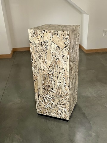 OSB Pedestal, modern wafter plywood furniture with a black inlay finish.