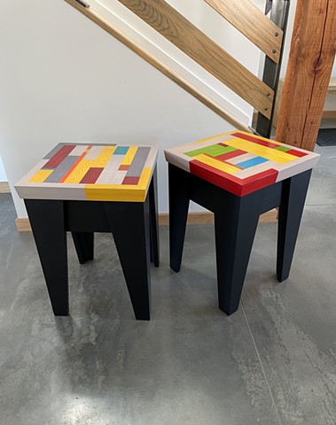 Modern Apollo Table with a black stained pine base and multi-colored cypress wood top.