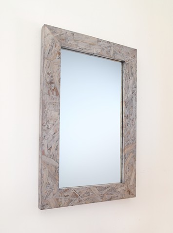 Modern gray wood mirror made from OSB panel with a transucent finish by Andrew Traub Studio.