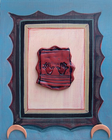 painting of a frame  around a porcelain design with hands, with porcelain crescents hanging down