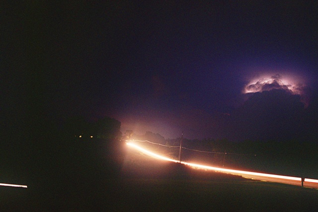 2009 summer storm to right with white traffic lights.