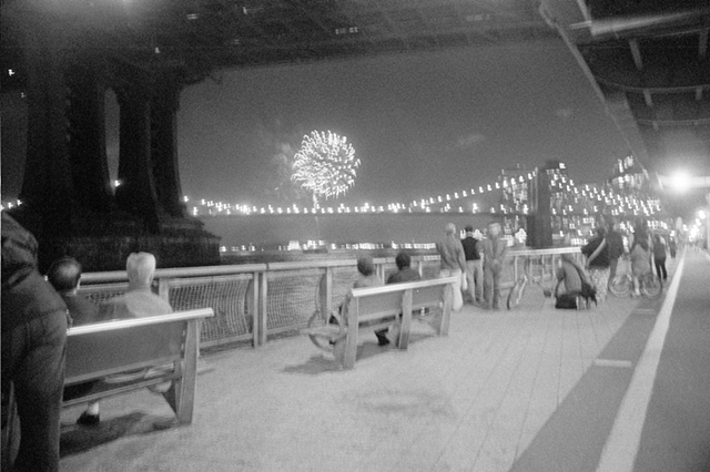 NYC 2009 people watching fireworks under FDR three [more exposed including bike path].