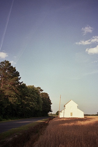 south carolina white barn and road. 