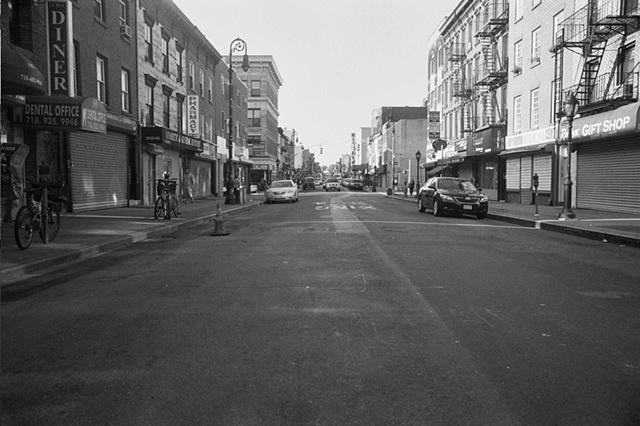 NYC 2009 Brooklyn street with pharmacy diner gift shop. 