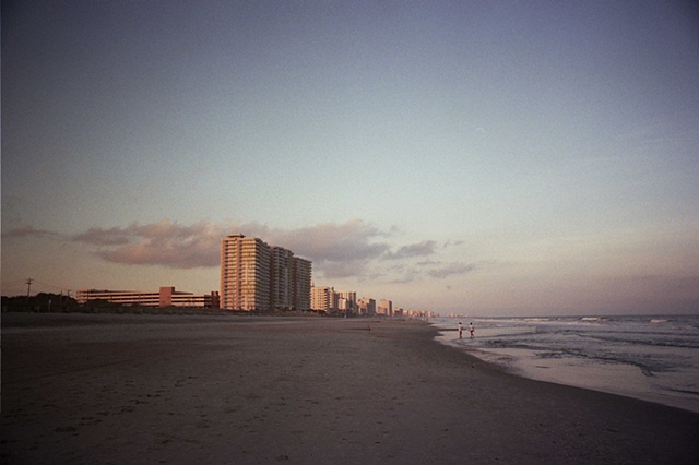 east coast low light buildings centered couple right of center. 