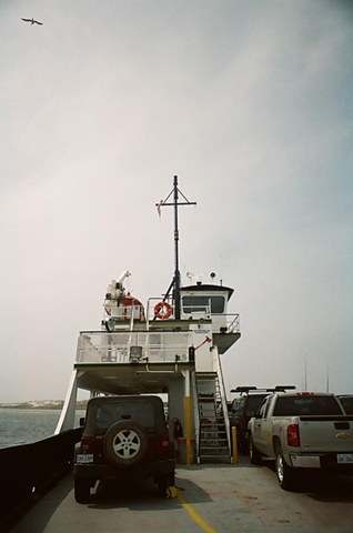 single gull in upper left of ferry from rear. 